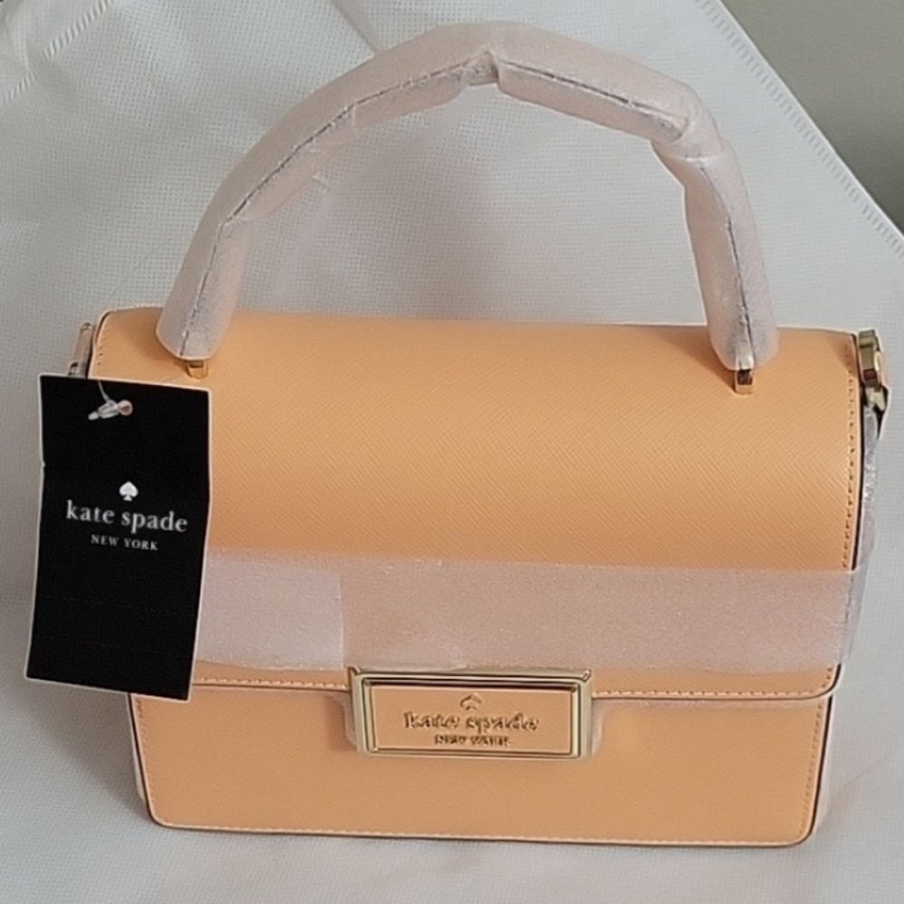 Kate Spade Reegan Orange Creme Crossbody. With unbranded dust bag. NWT.